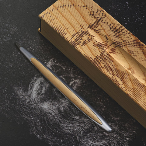 Pininfarina Segno "Cambiano Leonardo Drawing" special Leonardo Da Vinci edition in Ethergraf Inkless pen with aluminum body and walnut wood inserts next to its base that has engraved a portrait of Da Vinci in pointillism.
