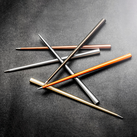 FO - Forever Made In Italy "Prima" Ethergraf inkless pen with anodized aluminum long body in several variants of color in a glittery black background.