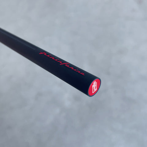 Close up of the end of the Pininfarina Segno "SMART" pencil in its red version with the logo Pininfarina in red and black painted aluminum body.