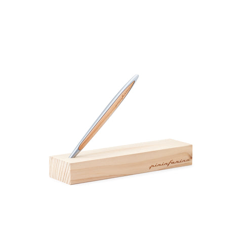 Pininfarina Segno "Cambiano Classic" Ethergraf Inkless pen with silver aluminum body and cedar wood inserts standing in its base in a white background.