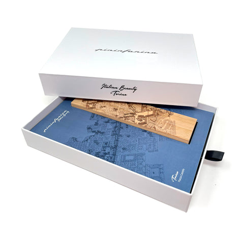 Packaging and base of the Pininfarina Segno "Cambiano Italian Beauty" Ethergraf Inkless or ballpoint pen with plans the city of Italy Torino in a white background.