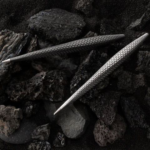 Pininfarina Speedform Transitions collections in its Titanium and silver versions with rocks background