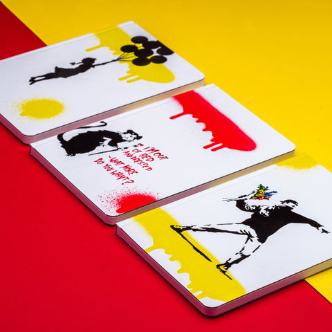 Pininfarina Segno special edition "Banksy's Graffiti Notebook" available in three versions with Bansky's works: "The Flower Thrower", "Floating Girl" and "Out of Bed Rat." with white backgrounds and black yellow and red graffiti.
