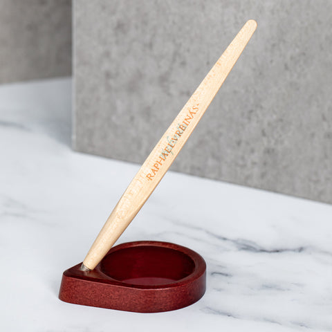 FO - Forever Made In Italy "Piuma Raphael Special Edition" with pear wood steam, standing in its circular red wood base + plexiglass lens. 