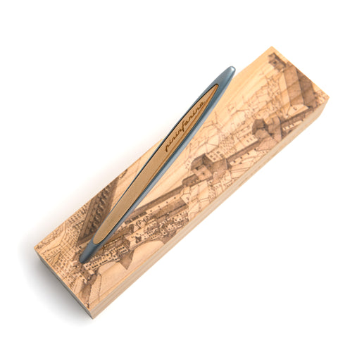 Closeup of the Pininfarina Segno "Cambiano Italian Beauty" Ethergraf Inkless or ballpoint pen with silver aluminum body and walnut wood inserts standing in its base with plans of different cities in Italy in a white background.
