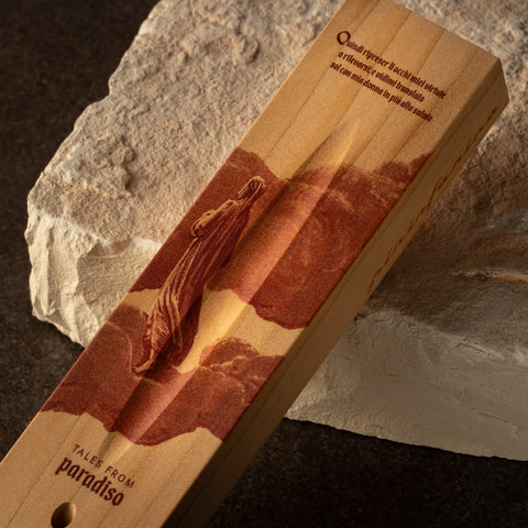 Close up of the base of the Pininfarina Segno "Cambiano Paradiso 700th edition" with an illustration of a fragment of the Divine Comedy of Dante Alighieri with a man walking in clouds.