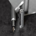 Close up of the cap of the Pininfarina Segno "PF ONE Fountain Pen" in its silver version. The cap has the Pininfarina logo in the tip.