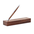 Pininfarina Segno "Cambiano Classic" Ethergraf Inkless pen with silver aluminum body and walnut wood inserts standing in its base in a white background.