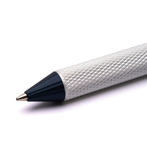 Close up of the tip of the Pininfarina Segno "Slider Maserati Edition" ballpoint pen with aluminum body and blue tip.