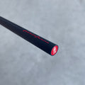 Close up of the end of the Pininfarina Segno "SMART" pencil in its red version with the logo Pininfarina in red and black painted aluminum body.