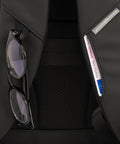 Close up of the back of the black Pininfarina Segno "Active" Backpack. Glasses hook and card holder