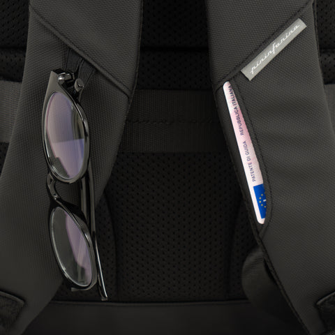 Close up of the back of the black Pininfarina Segno "Active" Backpack. Glasses hook and card holder