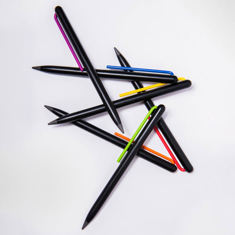 Several "Grafeex pencils" piled up in a white background.