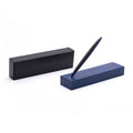 Pininfarina Segno "Cambiano Ink Blu Maserati Edition" ballpoint pen with blue aluminum body and black rubber inserts standing in its blue base with the maserati logo in a white background next to its packaging box.