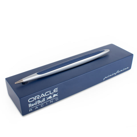 Pininfarina Segno "Cambiano Oracle Red Bull Racing" special edition pen, in Ethergraf Inkless tip. Aluminum body with blue painted wood inserts lying in its blue base.