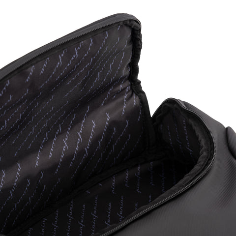 Close up of the interior of the black Pininfarina Segno "Active" Backpack. Lining with logo pattern in blue with black background.