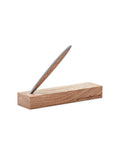 Pininfarina Segno "Cambiano Classic" Ethergraf Inkless pen with silver matt black aluminum body and walnut wood inserts standing in its base in a white background.