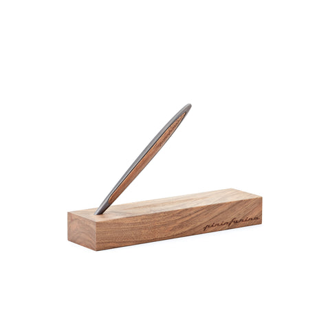 Pininfarina Segno "Cambiano Classic" Ethergraf Inkless pen with silver matt black aluminum body and walnut wood inserts standing in its base in a white background.
