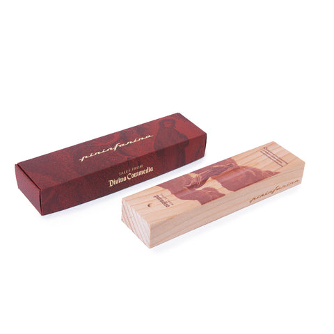 Packaging and base of the Pininfarina Segno "Cambiano Paradiso 700th edition" with an illustration of a fragment of the Divine Comedy of Dante Alighieri with a man walking in clouds.