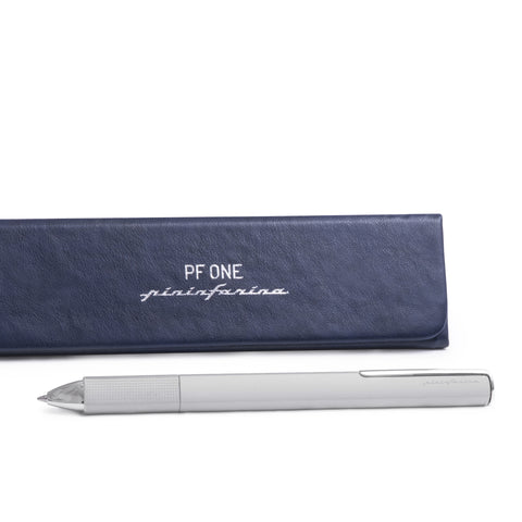 Pininfarina Segno "PF ONE Ballpoint" in its silver version next to its packaging box.