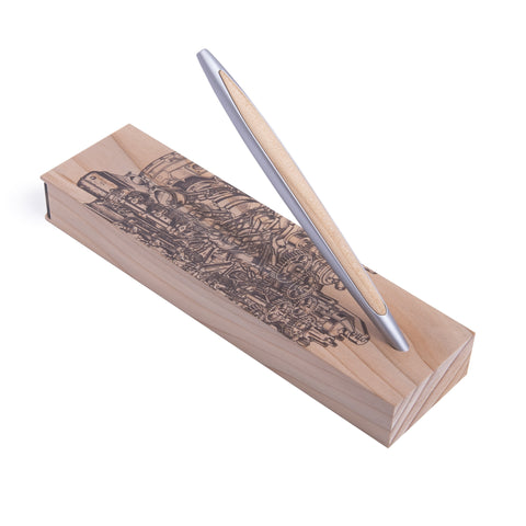 Pininfarina Segno "Cambiano Engine Maserati Special Edition" luxury ethergraf inkless pen with aluminum body and cedar wood inserts standing in its cedar wood base with a drawing of an engine.