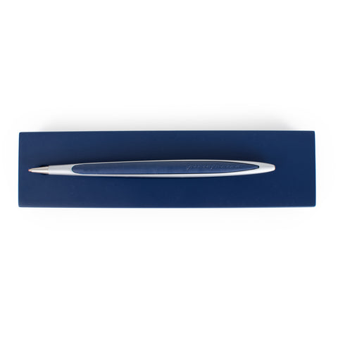 Pininfarina Segno "Cambiano Oracle Red Bull Racing" special edition pen, in ballpoint ink tip. Aluminum body with blue painted wood inserts lying in its blue base.