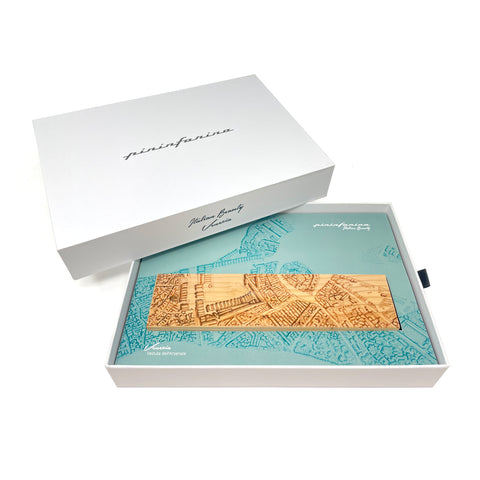 Packaging and base of the Pininfarina Segno "Cambiano Italian Beauty" Ethergraf Inkless or ballpoint pen with plans the city of Italy Venice in a white background.