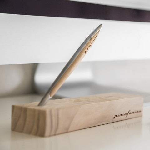 Pininfarina Segno logo in the "Cambiano Classic" Ethergraf Inkless pen with aluminum body and cedar wood inserts and base.
