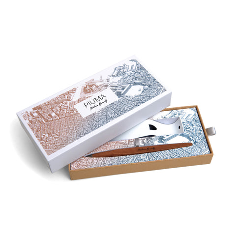 Packaging box of the FO - Forever Made In Italy "Piuma Italian Beauty" Pen with pear wood steam in the version "Napoles", along its stainless steel ondulated base. The box contains plans drawings of the city of Naples.